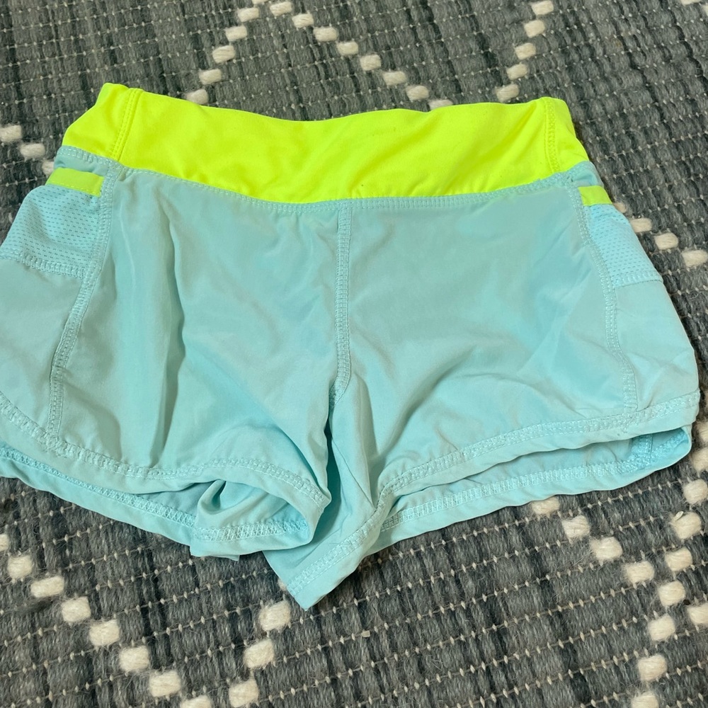 Neon yellow blue athletic shorts